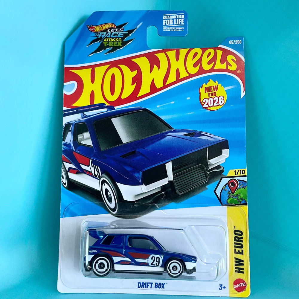 A Hot Wheels Drift Box toy car in its original blister card packaging, displayed against a bright turquoise background. The packaging features the classic Hot Wheels logo and depicts a blue and white drift car.