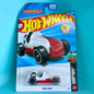 A packaged Hot Wheels Monopoly Pass 'N 60 toy car on a blue background. The carded packaging features the Hot Wheels logo, a blue and white background, and shows the toy car inside a clear blister pack.