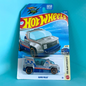Hot Wheels Rampage Series 4 HW Heavyweights Rapid Pulse toy truck in its original blister card packaging, set against a solid turquoise background.