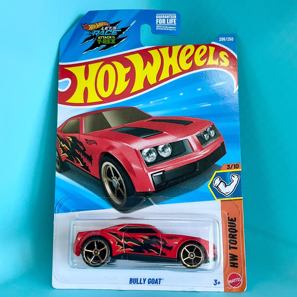A Hot Wheels die-cast toy car in its original blister packaging, featuring the 'Billy Goat' model. The red car has black flame decals and gold wheels, and the packaging displays the Hot Wheels logo and a blue 'Innovating for Life' badge against a bright turquoise background.