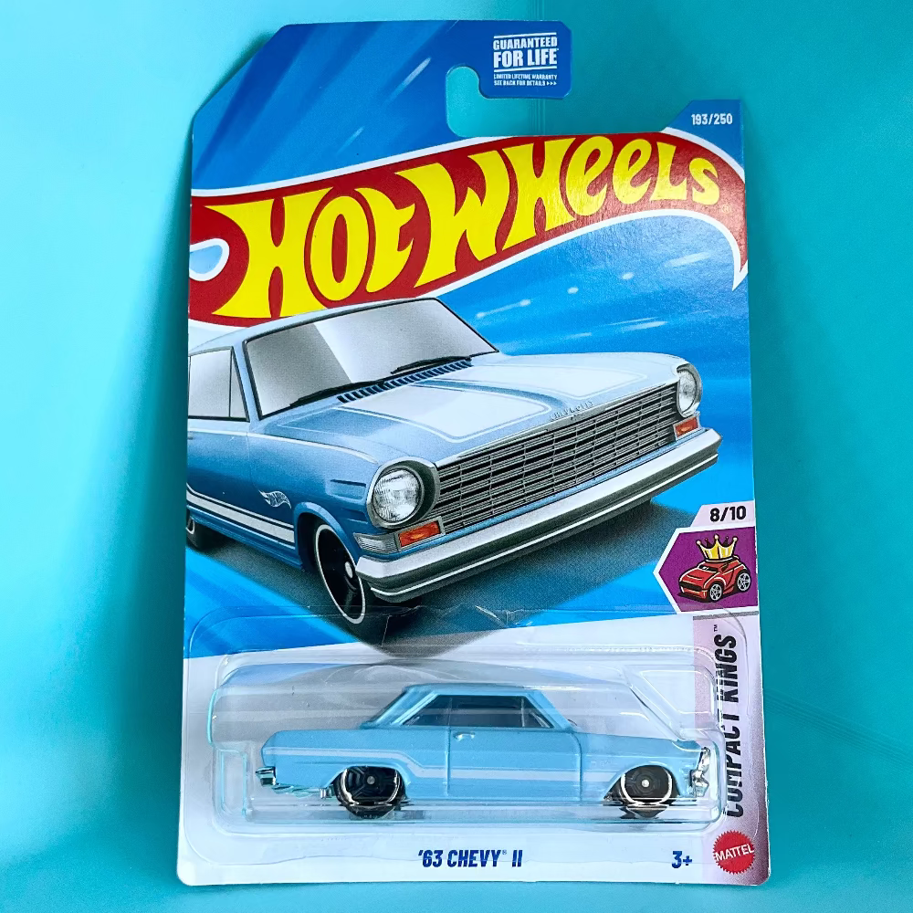 A Hot Wheels '63 Chevy II die-cast toy car in its original blister card packaging, displayed against a solid turquoise background.