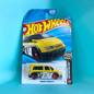 A Hot Wheels die-cast toy car in its original blister packaging, featuring a yellow Renault Espace F1 race car with black and white racing decals. The cardback displays the Hot Wheels logo and a blue gradient background.