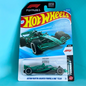 A Hot Wheels Formula 1 die-cast toy car in its original blister packaging, featuring the Aston Martin Aramco team livery. The packaging displays a blue and white graphic background with the iconic red and yellow Hot Wheels logo.