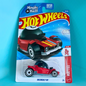 Hot Wheels Decidely Go toy car in its original Magic 9 Ball blister packaging, set against a bright cyan background.