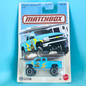 Matchbox Chevy Silverado 4x4 toy truck in its original blister card packaging, featuring a light blue truck with yellow and black graphics, set against a solid light blue background.