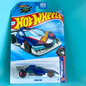 A Hot Wheels toy car in its original blister card packaging, featuring the 'Punk Rod' model from the Fast Lane Pass. The blue race car is visible through the clear plastic bubble, set against a bright turquoise background.