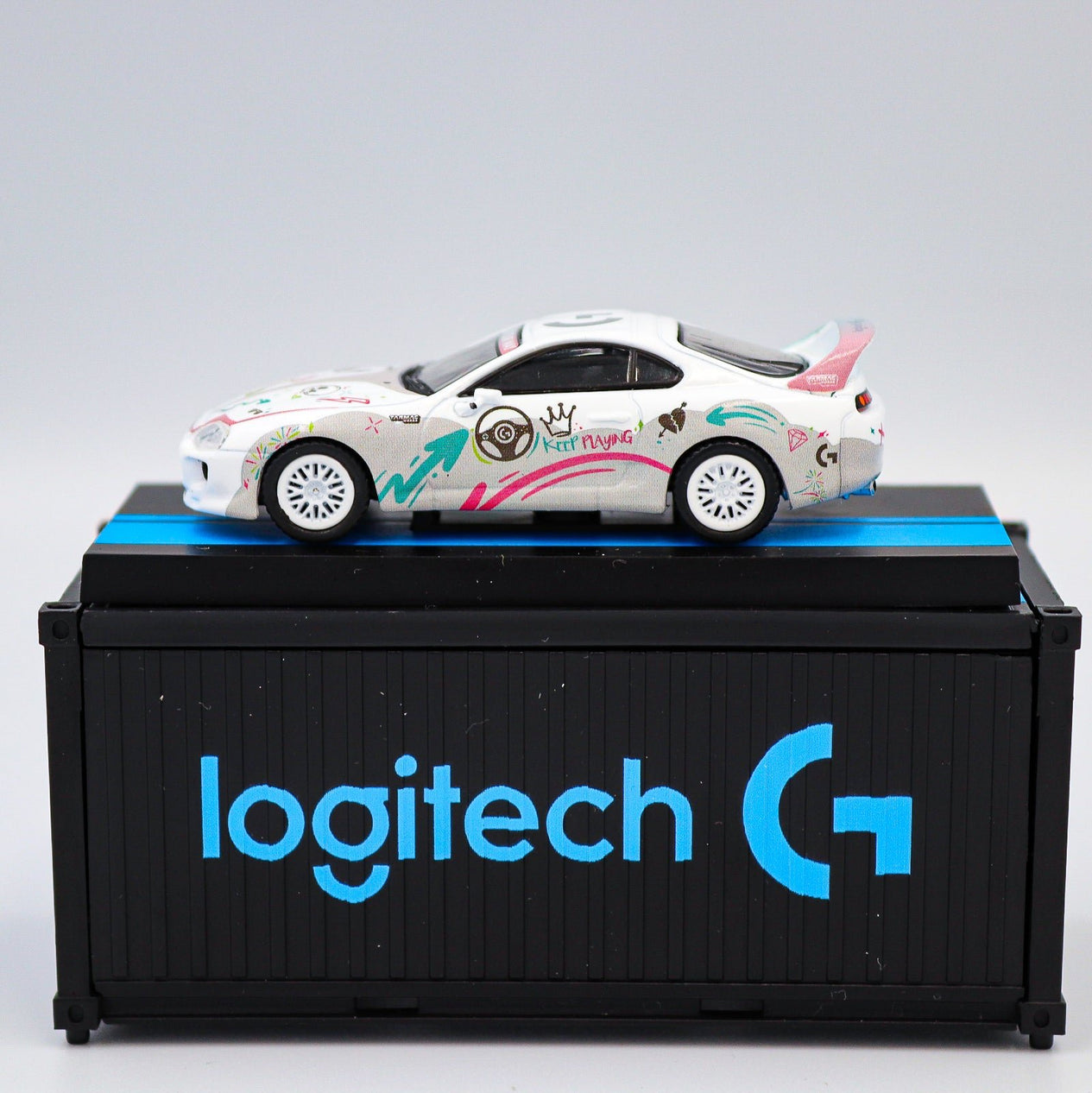 Tarmac Works - Toyota Supra RZ Logitech G Aurora with Container - Hobby 64 - Scale 1:64