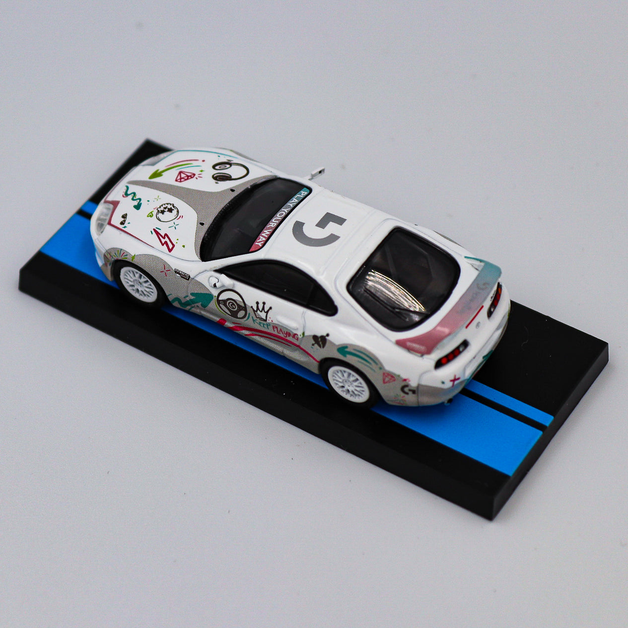 Tarmac Works - Toyota Supra RZ Logitech G Aurora with Container - Hobby 64 - Scale 1:64